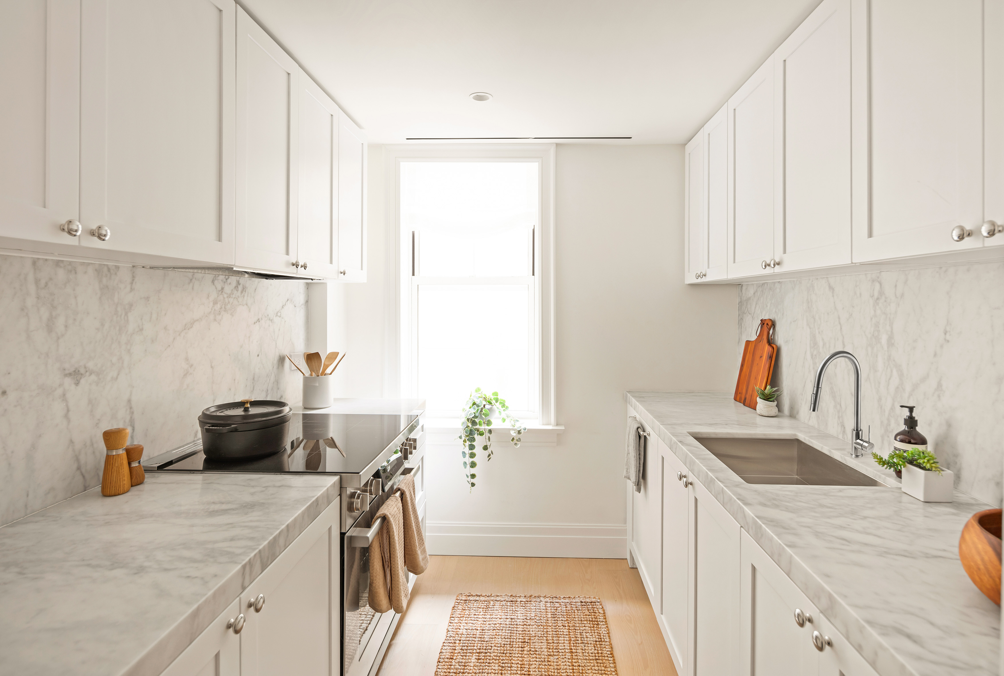 Kitchen in honed Bianco Carrara marble