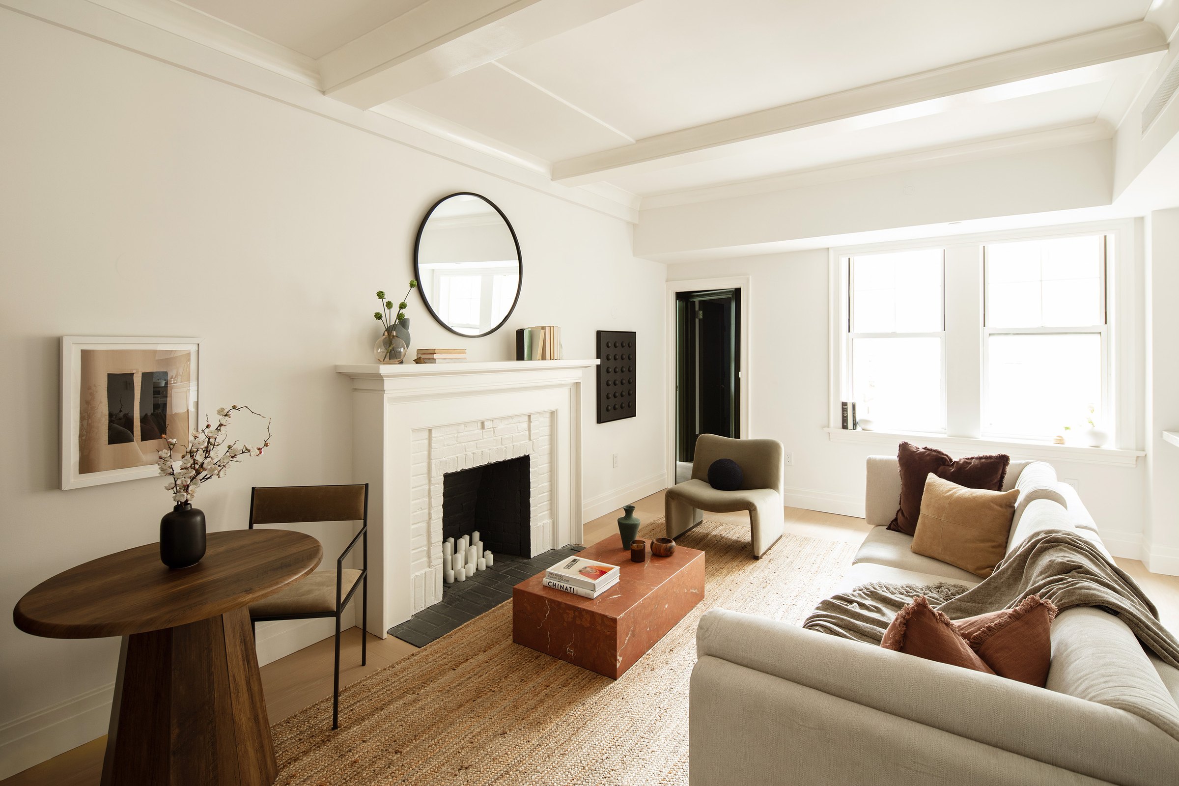 Living room with original decorative fireplace at 26 West 9th Street