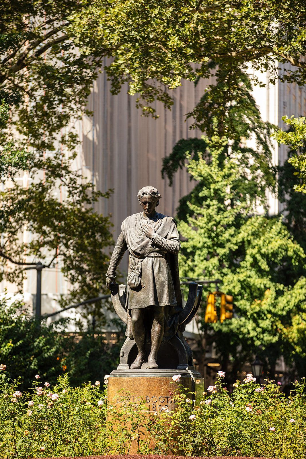 The Edwin Booth statue among the roses of Gramercy Park